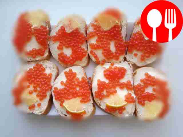 Quick sandwiches with red caviar and lemon