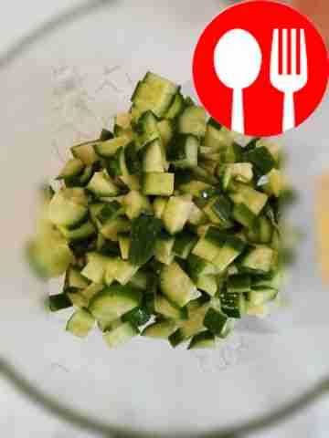 Slice cucumbers into a salad bowl.