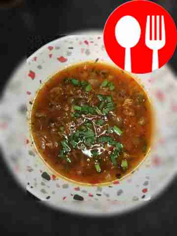 Light soup with canned peas and sprat in tomato