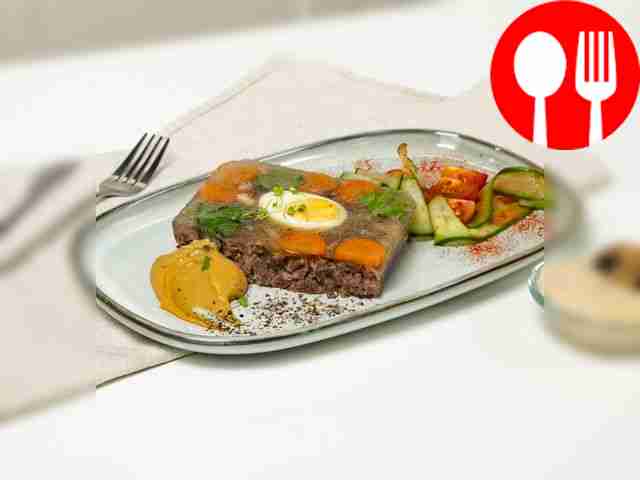 Spicy beef jellied meat with herbs and vegetables