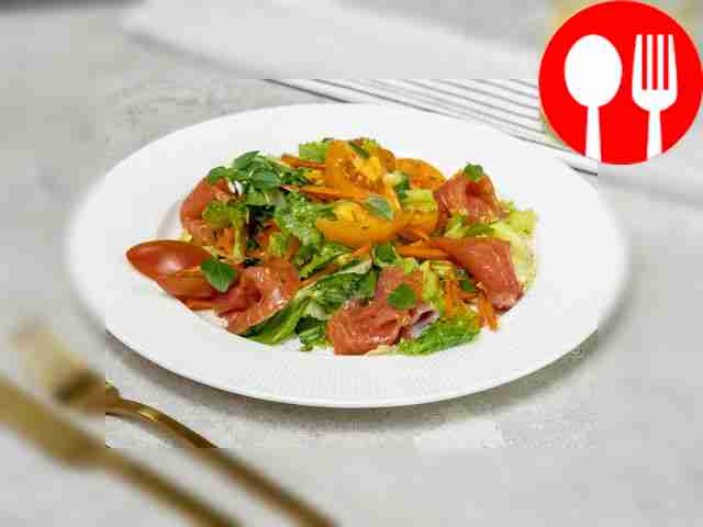 Quick fish salad from lightly salted trout