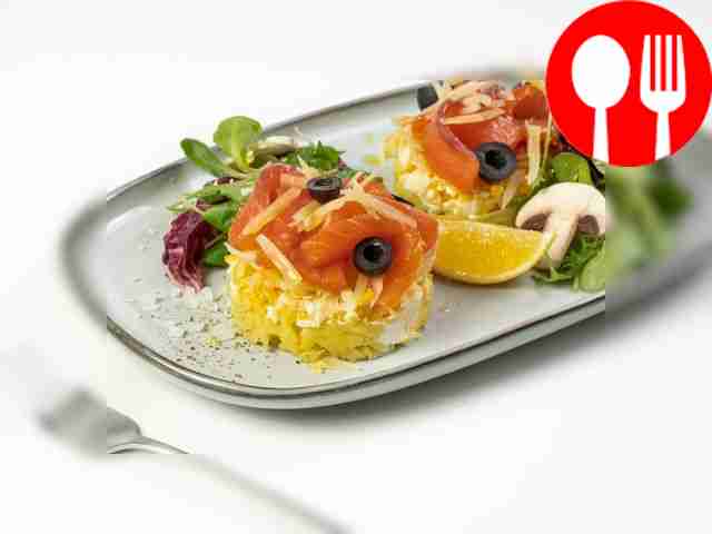 Layered fish salad with trout and potatoes