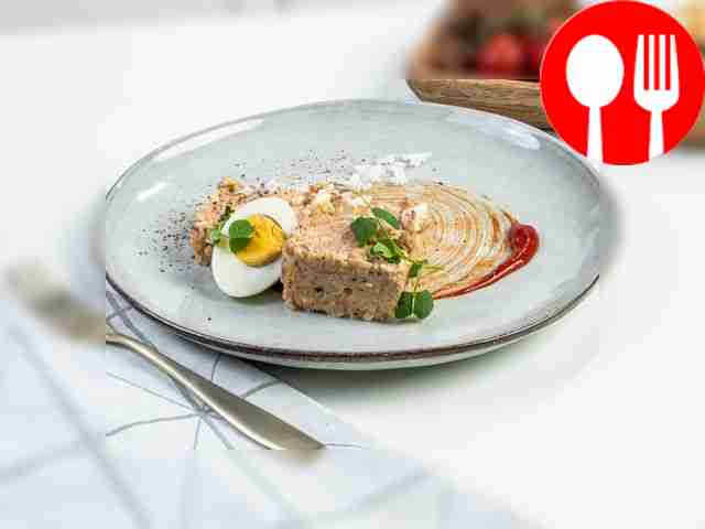 Salad with rice and sprat in tomato