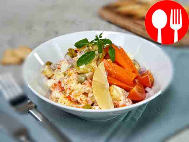 Boiled fish salad with pickled cucumber