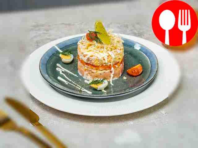 Salad cake with pink salmon