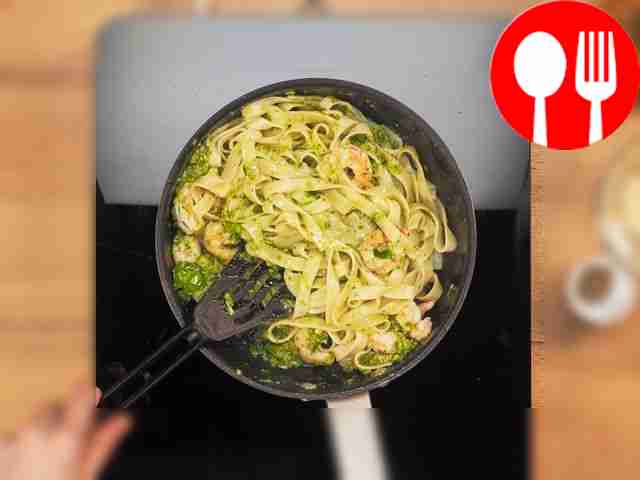 Prepare shrimp pasta with pesto sauce. Place...