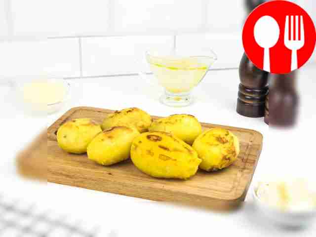 Remove the skins from the cooled potatoes.
