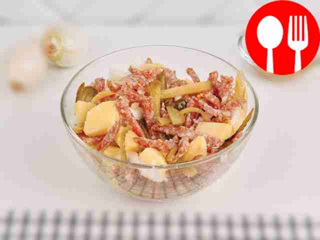 Appetizer of potatoes, cucumber and salami