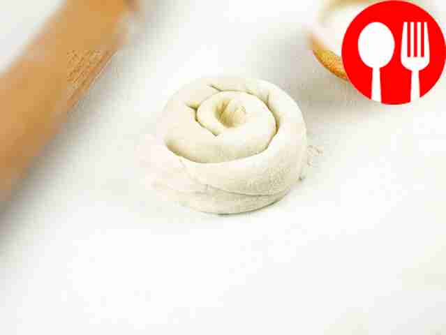 Roll the dough into a tube and twist it into a...