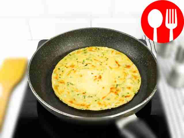 Unfold the flatbread and fry it in a frying...