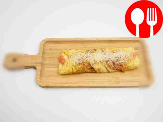 Place the finished omelette on a board or...