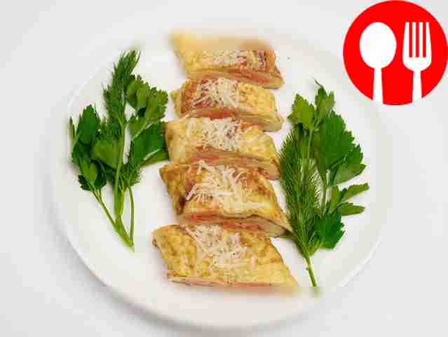 Place the omelette pieces beautifully on a...