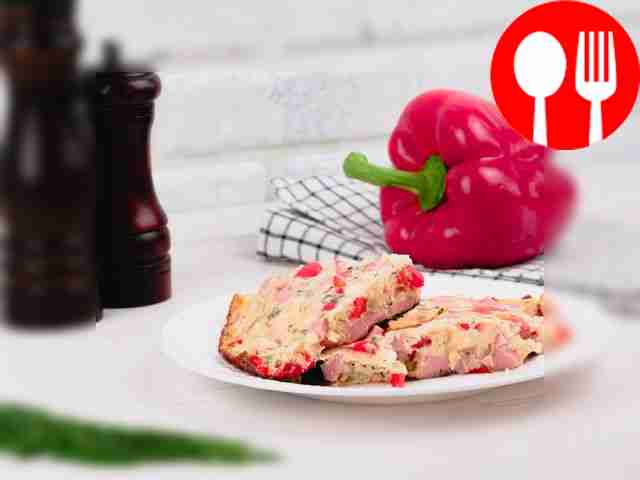 Omelet with boiled sausage and vegetables