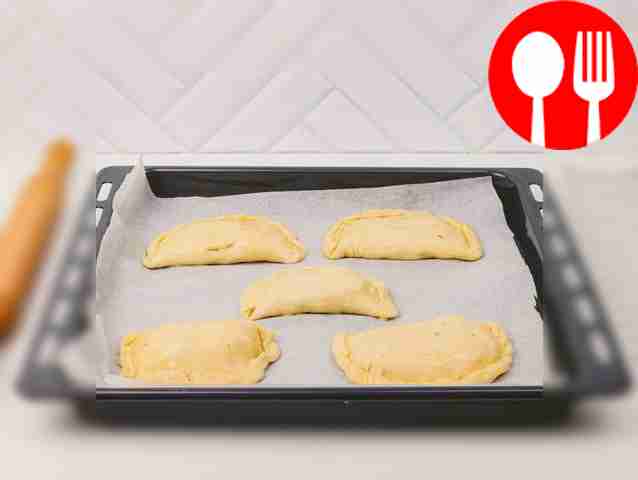Cover the dough with parchment paper, place...