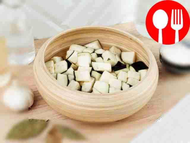 Place the chopped eggplant in a deep...