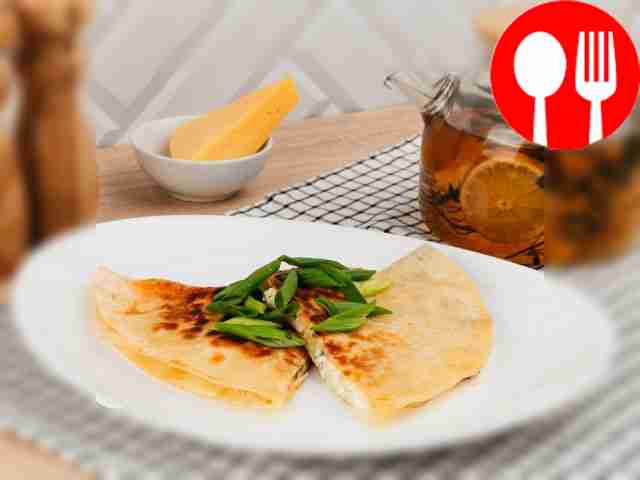 Lavash with cottage cheese and egg in a frying pan