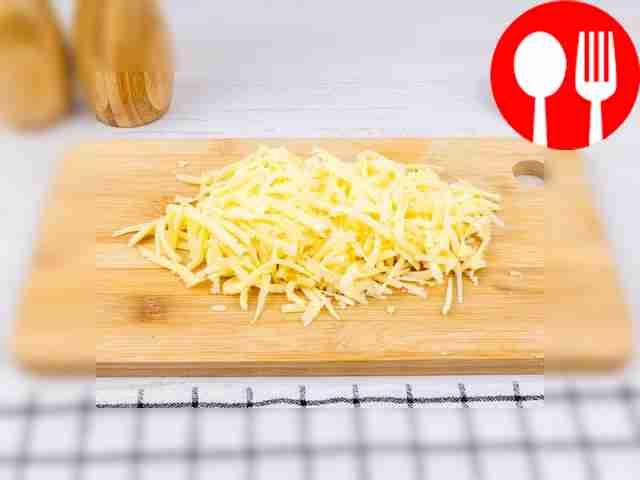 Grate the cheese on a coarse grater.