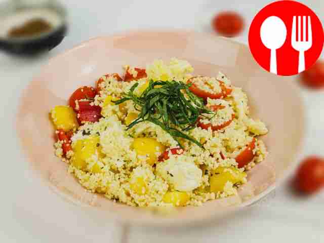 Salad with couscous, mozzarella, cherry tomatoes and bell pepper