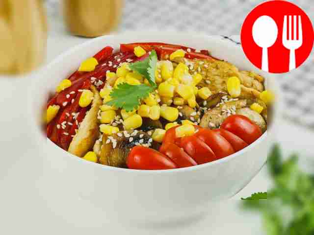 Bowl with couscous, chicken, champignons and bell pepper