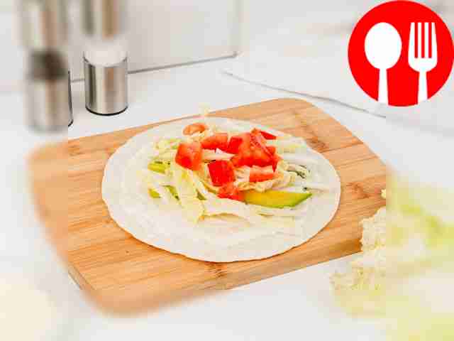 Place the tortilla on a cutting board....
