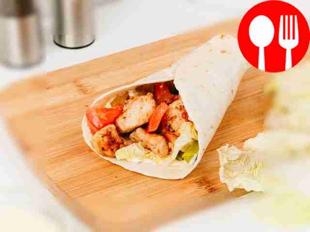 Place the cooked chicken on top and fold the...