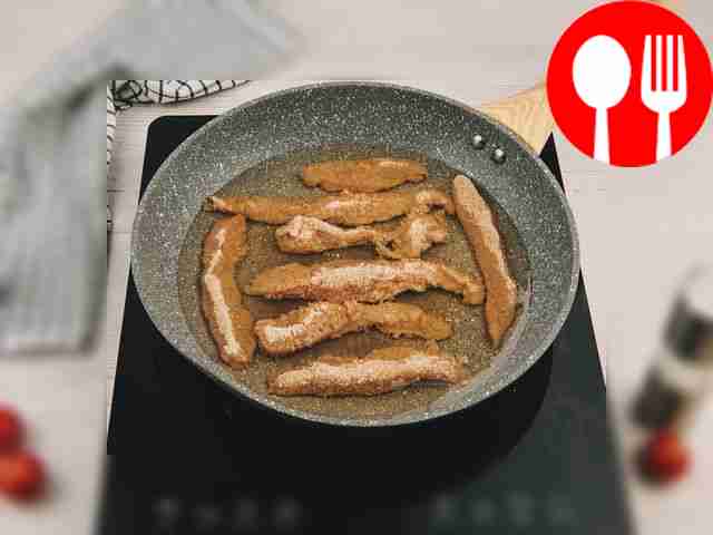 Place breadcrumbs on a flat plate. Roll the...