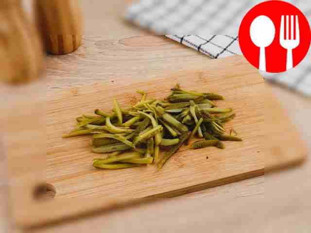 Remove the cucumbers from the brine, dry with...