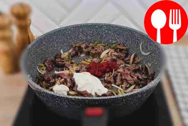 Add tomato paste and sour cream to the pan, carefully