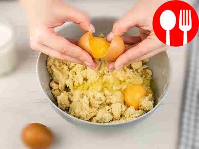 Add two eggs to the grated ingredients. Add some salt.