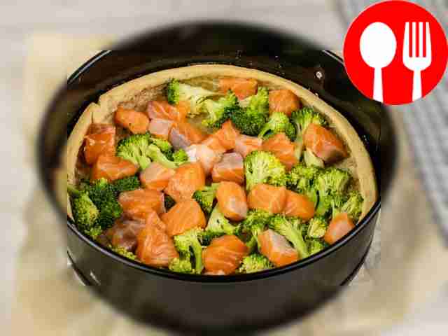Place the salmon and broccoli in the pan.