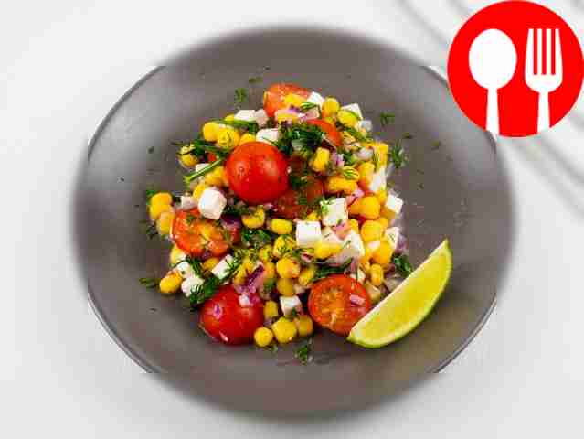 Salad with corn, cherry tomatoes and cheese
