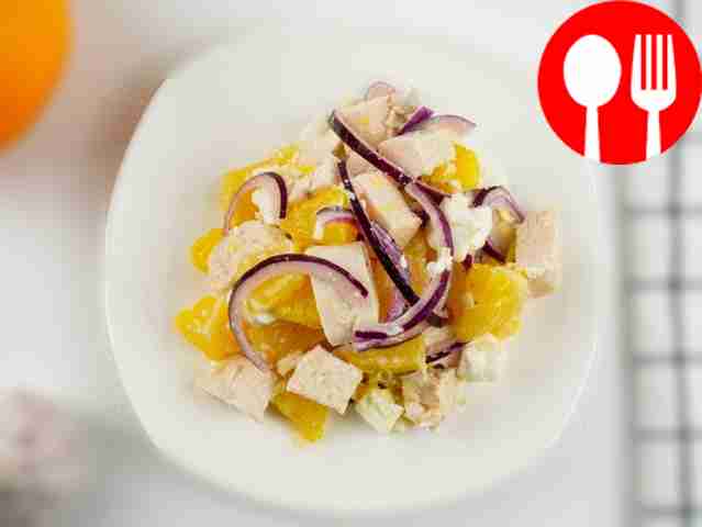 Salad with chicken fillet, feta cheese and orange