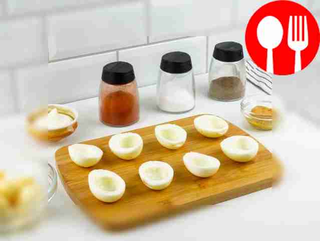 Cut the cooled eggs in half. Remove the yolks...