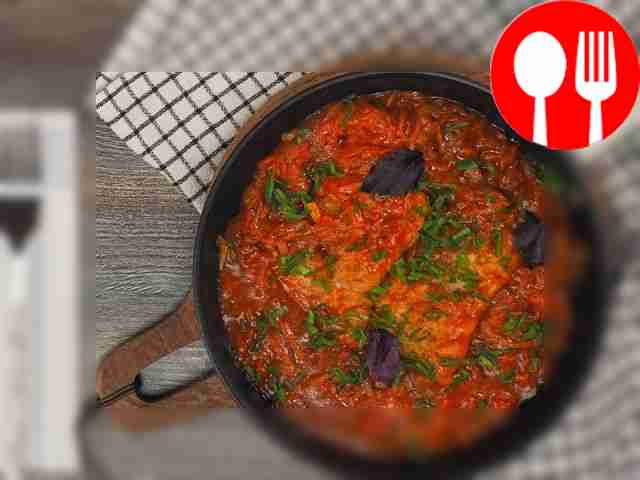 Fish in sauce in a frying pan