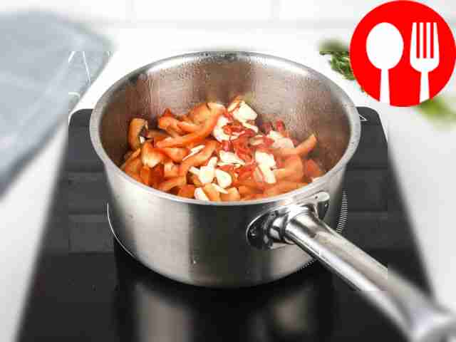 Add garlic and chili pepper to the vegetables....