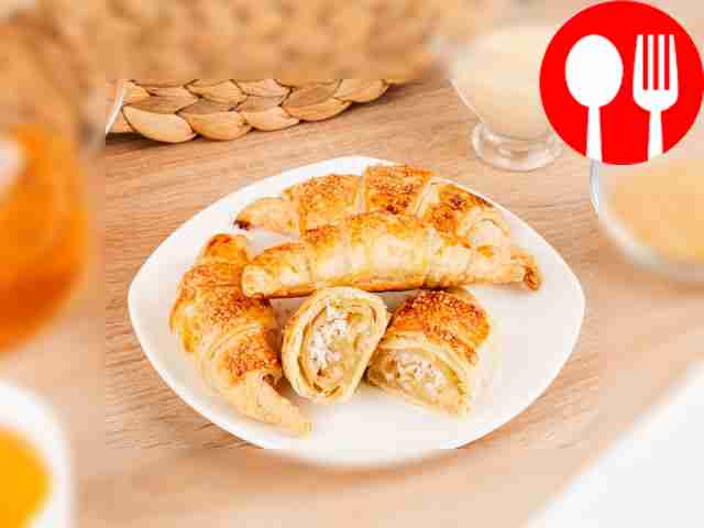 Croissants with condensed milk and coconut flakes