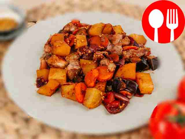 Baked stew with vegetables, pork and paprika
