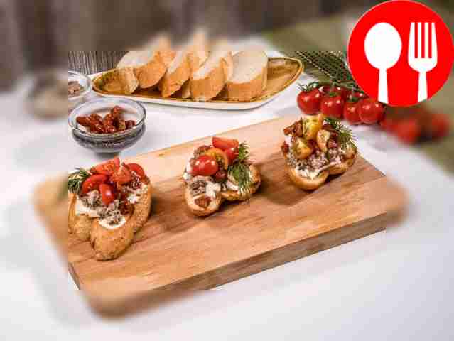 Bruschetta with sardines, cheese and tomatoes