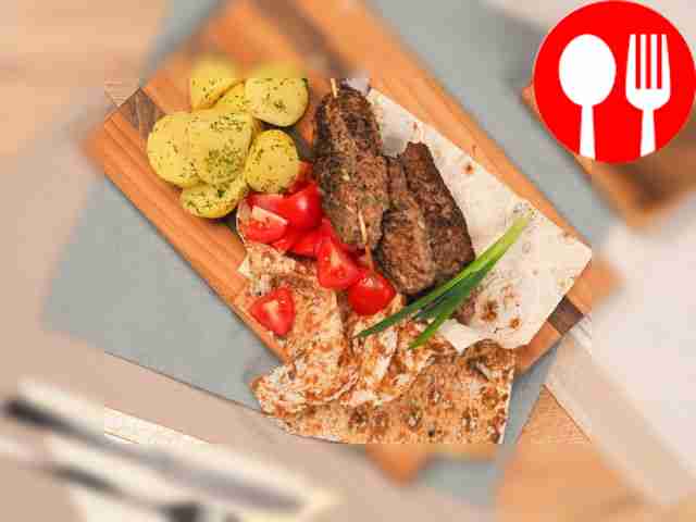 Serve lula kebab, cooked in an electric kebab...