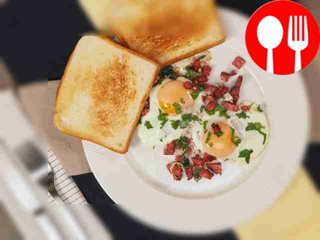 Serve hot scrambled eggs and sausage with crispy toast.