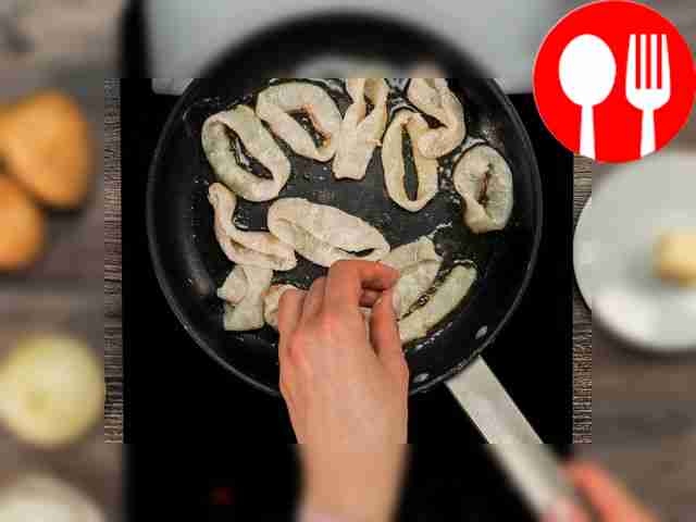 Fry the squid. Place the frying pan on the...