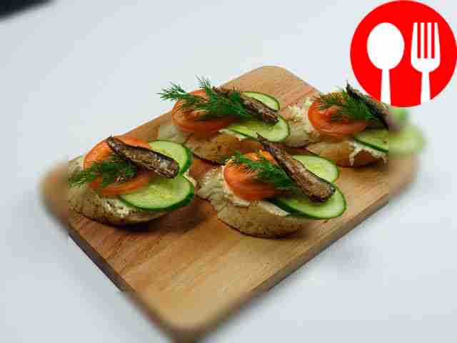 Sandwiches with sprats and cheese
