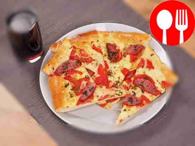 Pizza with sausage and tomatoes