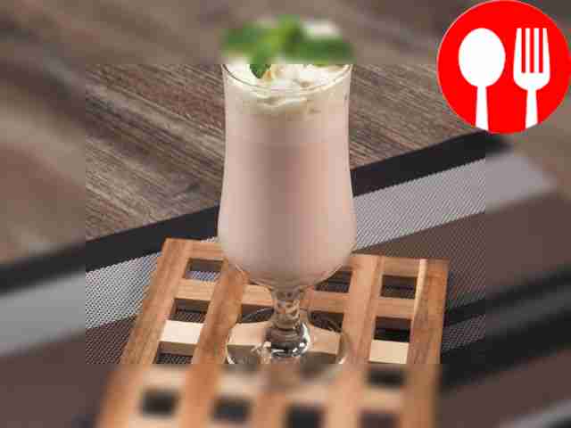 Chocolate milkshake with ice cream and confectionery toppings