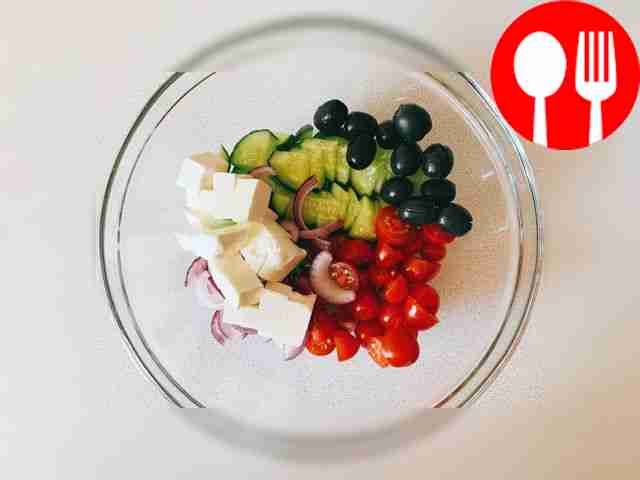 Add olives. If desired, they can be cut in half.