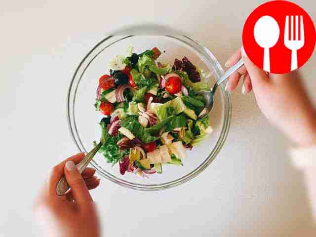 Season the salad with olive oil, salt and...