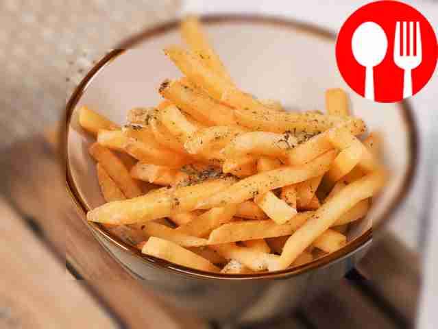 Frozen French fries in a frying pan