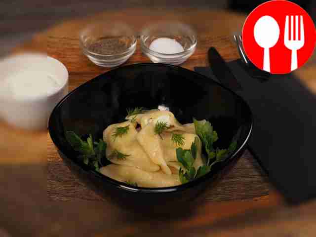 Before serving, garnish dumplings with Adyghe...