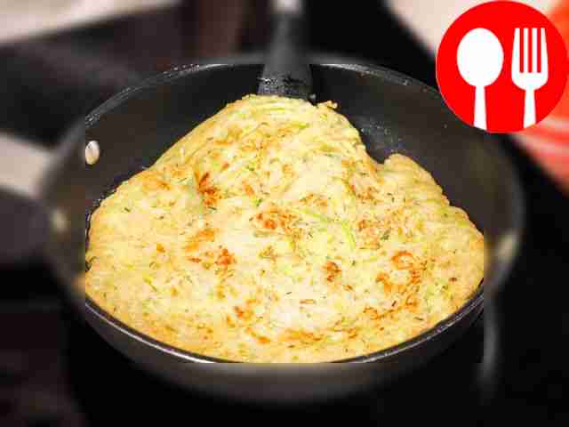 Cook zucchini pancakes in a frying pan. Grease...