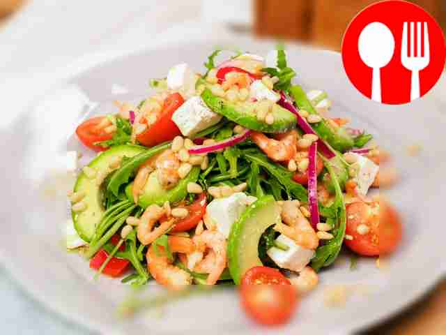 Salad with avocado and pine nuts